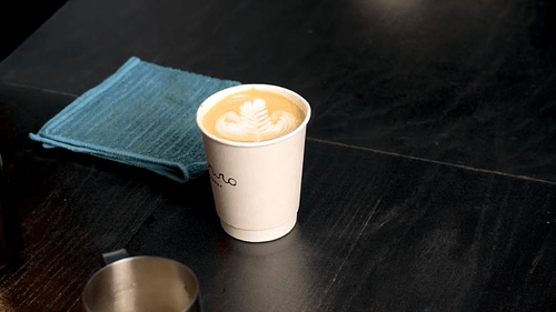 Latte art in take-away glasses